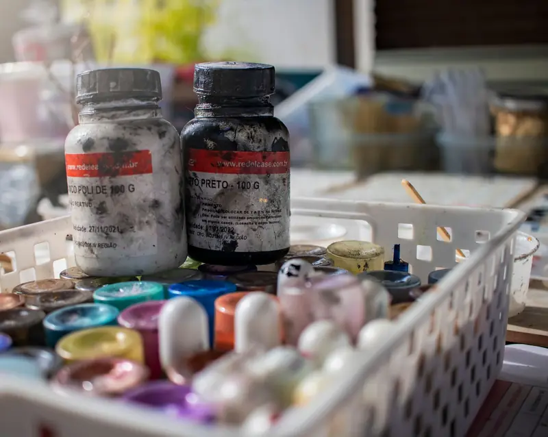 Close-up of paint bottles in a vibrant Brazilian art studio showcasing creativity