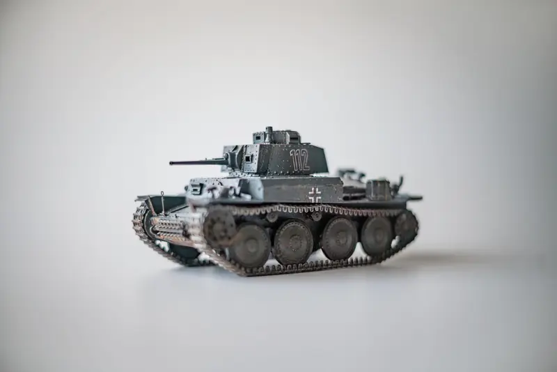 Detailed model of a WWII German tank on a white surface, perfect for historical enthusiasts